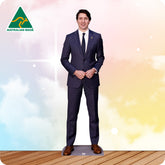 Man in a suit standing on a wooden floor with a colorful gradient background and Australian Made logo.